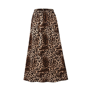 Detail of high waist leopard print maxi skirt with elastic waistband and soft draping fabric