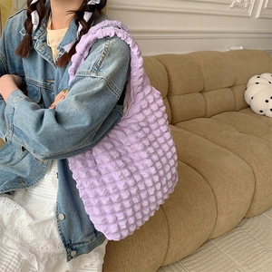 Detail showing lavender bubble texture fabric on a large capacity shoulder tote bag