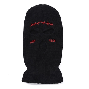 Detail of black 3-hole ski mask featuring red barbed wire and NOT NICE embroidery