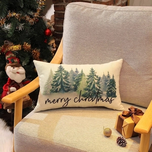 Detailed Christmas linen lumbar pillowcase featuring snowy pine trees on a wooden chair
