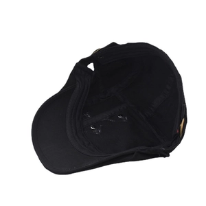 Detail view of the black cotton duckbill cap interior showing sweatband and stitching