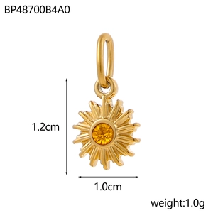 Detailed view of a gold sun pendant with yellow gemstone and dimension measurements