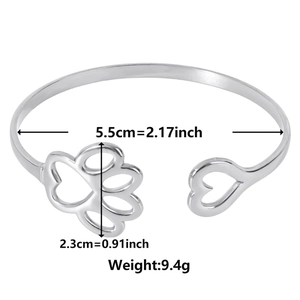 Polished silver stainless steel open bangle with hollow heart and paw print charms