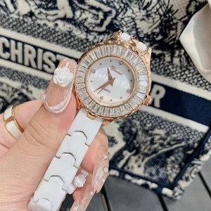 Women's white ceramic watch with rose gold diamond bezel and mother of pearl dial