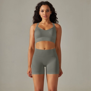 Close-up of high-elasticity knitted fabric on a dark olive yoga sports set with V-neck