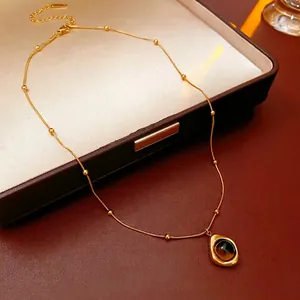 Irregular tiger eye stone pendant necklace with gold beaded chain in jewelry box
