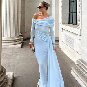 Elegant light blue one-shoulder long sleeve dress with pleated details and trailing ribbon