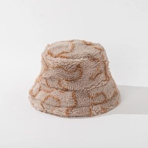 Detailed texture of warm striped lamb wool bucket hat in beige with brown embroidery