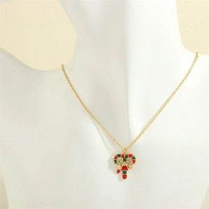 Detail of Christmas heart candy cane pendant with red and green enamel and micro-crystals