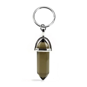 Macro view of a smokey quartz hexagonal prism pendant with a silver metal keychain