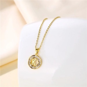 Detail of 18K gold stainless steel necklace with round letter K zircon pendant