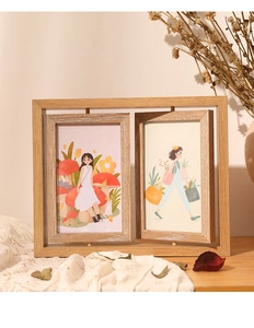 Detail of a rotating double-sided wooden photo frame with natural wood grain texture