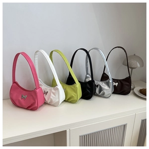 Pleated PU leather underarm bags in multiple colors with butterfly metal buckle details
