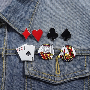 Set of 7 poker card enamel pins featuring Ace, King, and Queen motifs on denim jacket