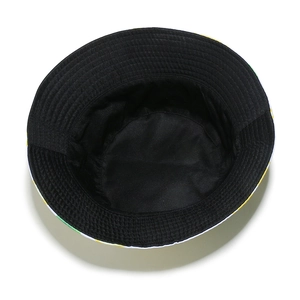 Inside view of black sun hat featuring soft fabric and lemon fruit print on the brim edge