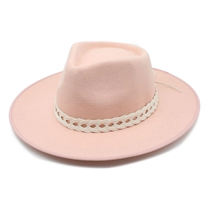 Detail of pink wool fedora hat featuring a white braided decorative band on white background