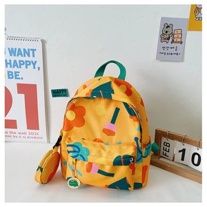 Detail of yellow floral kids backpack with matching coin purse and green carry handle