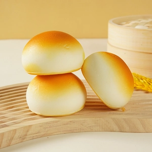 Realistic slow-rebound PU steamed bun stress relief toy with golden toasted finish