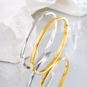Polished stainless steel oval bangles in gold and silver finish for couples