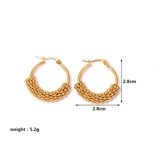 Detail view of 2.8cm twisted gold hoop earrings with weight and size specifications