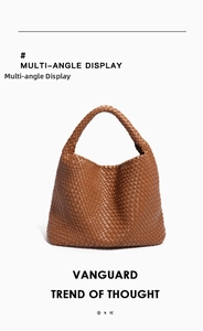 Detail of tan hand-woven leather hobo bag showing intrecciato texture and seamless handle