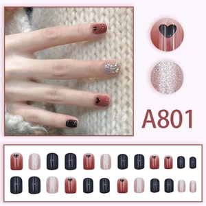 Colorful heart glitter press-on nails with red gradient and black heart designs A801
