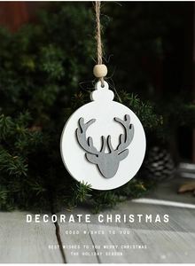 Detail of wooden reindeer ornament with natural jute rope and beads on a Christmas tree