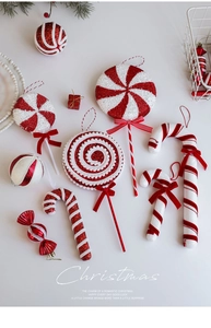 Detailed view of red and white Christmas candy ornaments with glitter and velvet texture