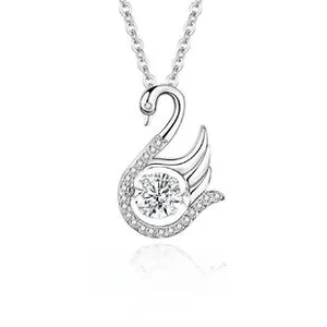 Close-up of S925 silver swan pendant with sparkling pavé crystals and central round stone