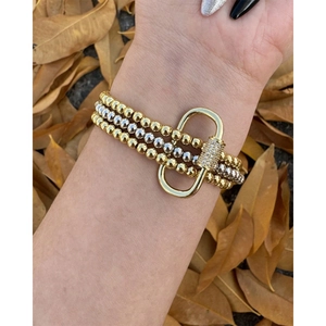 Set di tre bracciali di perline bicolore con chiusura a moschettone e cristalli incastonati