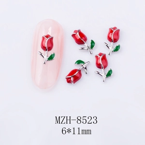 Macro detail of 6x11mm red tulip nail art charms with colorful enamel and metal base