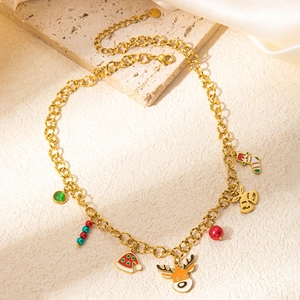 Close-up of golden Christmas necklace with elk, Santa hat, and enamel bell charms