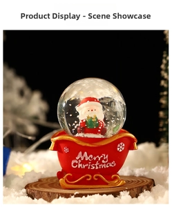Christmas sleigh snow globe with Santa Claus inside a red resin Merry Christmas base