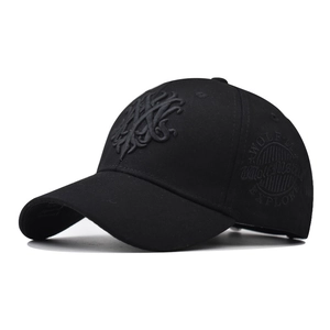 Detail view of black cotton baseball cap with 3D wolf embroidery and curved brim