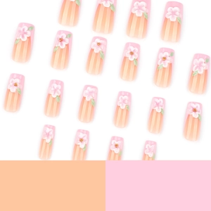 3D pink floral press-on nails with white relief flowers on pink and nude gradient base