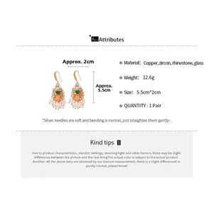 Macro detail of drop tassel earrings featuring colorful crystals and zircons measuring 5.5cm