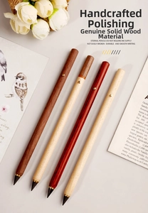 Detailed view of four assorted colors solid wood inkless pencils on artistic desk