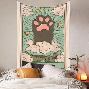 Detail of bohemian tapestry featuring a cartoon cat paw and clouds in tarot card style