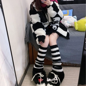 Kawaii Lolita style striped leg warmers paired with platform shoes and fleece jacket