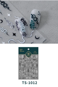 Macro detail of 3D dark snake and moon nail art stickers with embossed matte texture
