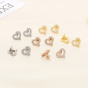 Elegant heart-shaped stainless steel earrings with sparkling crystal pavé in three metal tones