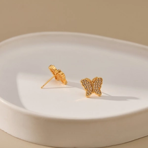 Exquisite butterfly stud earrings plated in 18K gold with white zircon wing micro-inlay