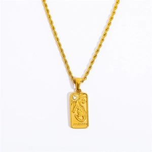 Detailed macro view of gold strength pendant with embossed tiger and small gemstone
