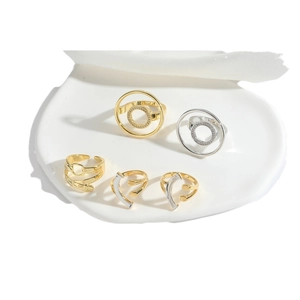 Exotic geometric open ring set with gold and silver finishes and crystal accents