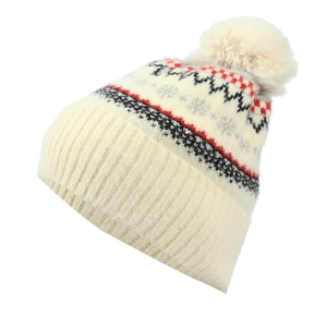 Detail of winter beanie featuring Nordic snowflake patterns and fluffy faux fur pom-pom