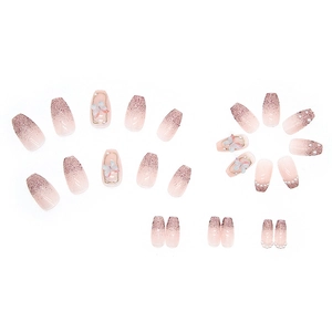 Pink purple gradient press-on nails with 3D butterfly, pearls, and shimmering glitter finish