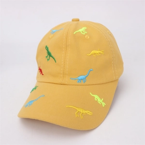 Detailed view of yellow cotton baseball cap featuring colorful dinosaur embroidery and stitching