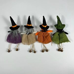 Set of four handmade Halloween witch dolls with pointed hats and colorful burlap skirts
