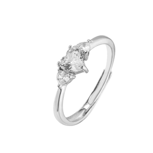 Detail view of heart-shaped zircon inlay on silver brass ring with an open band design