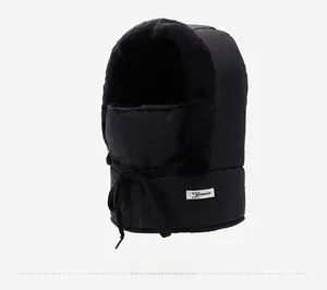 Side view of black winter trapper hat with integrated mask and warm plush lining